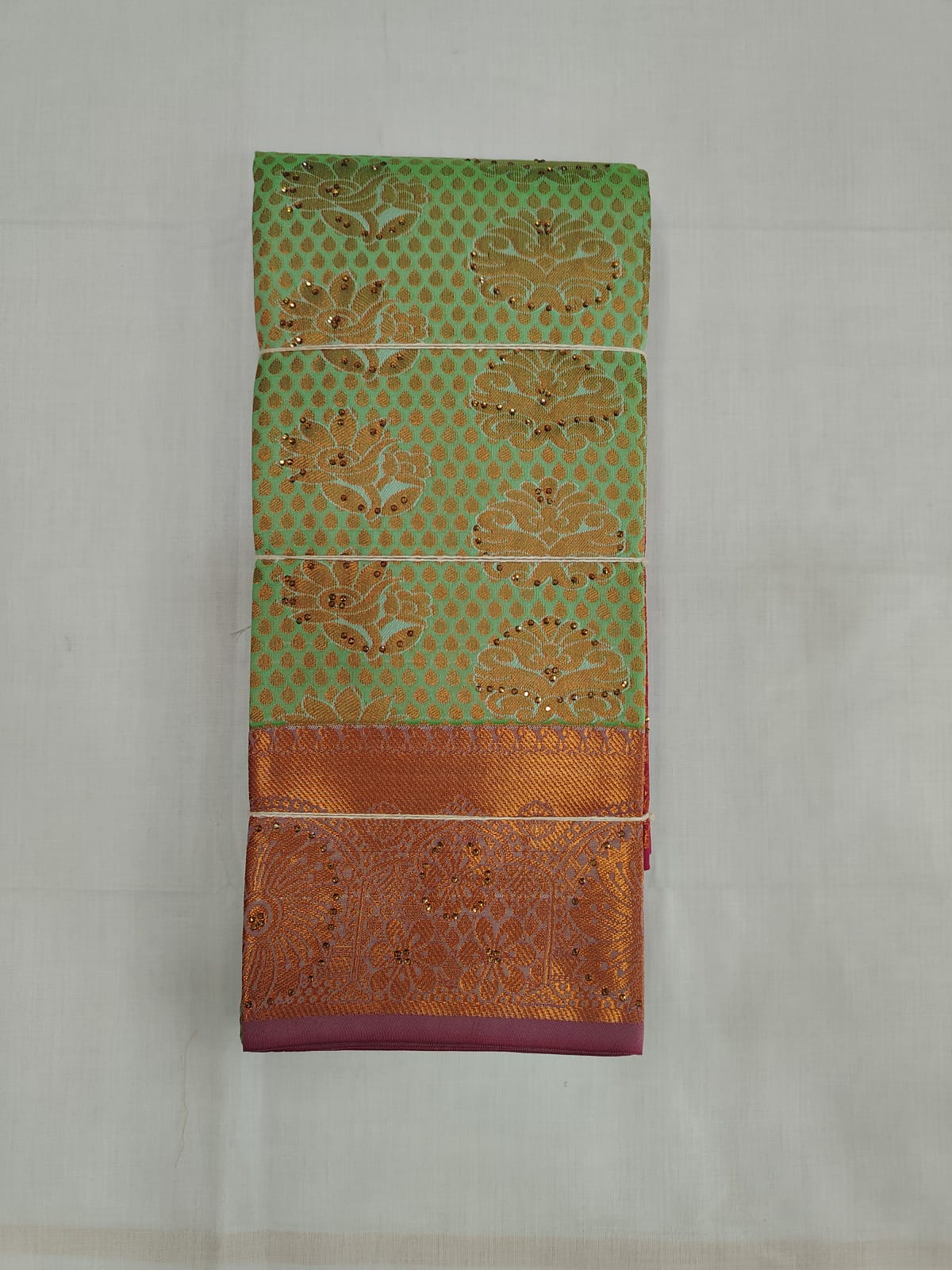 Mint Green Silk Saree with Copper Zari Butta Motifs & Rich Border
