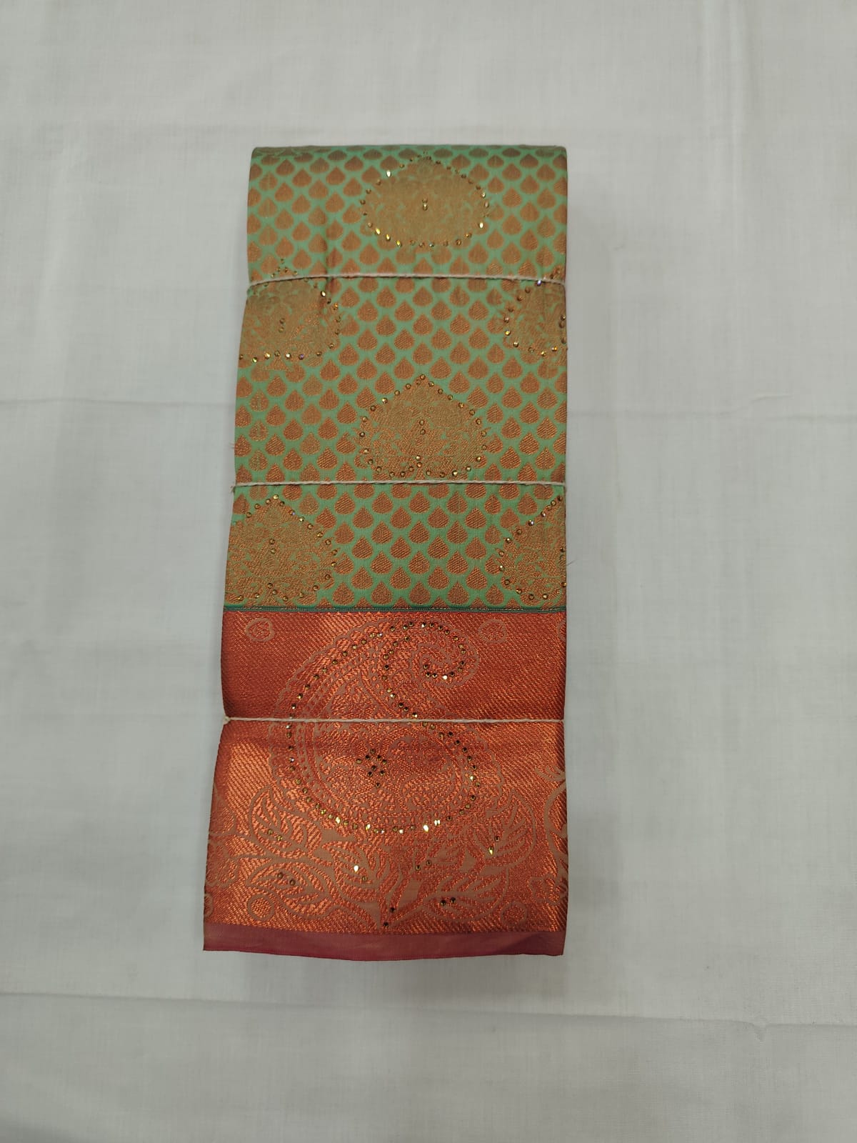 Pista Green Silk Saree with Copper Zari Butta Motifs & Rich Border