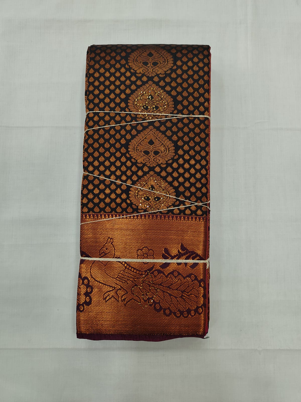 Elegant Black Silk Saree with Copper Zari Motifs & Rich Peacock Border