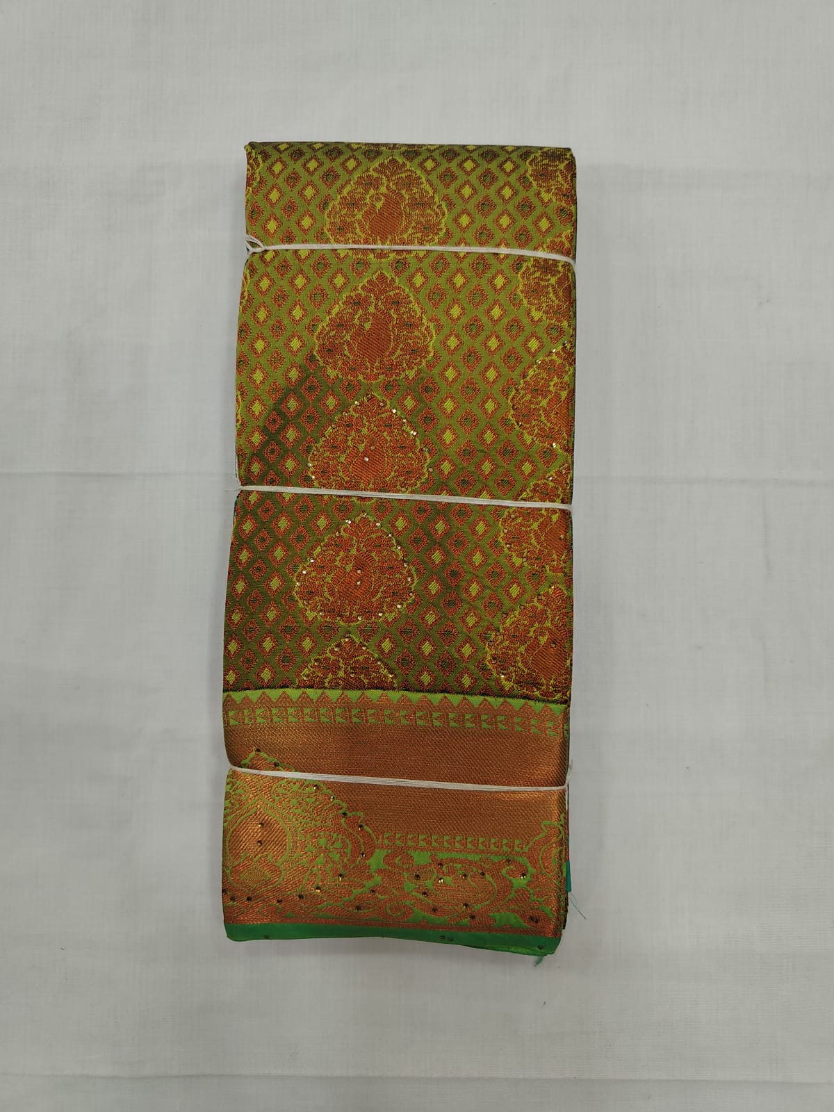 Bright Green Silk Saree with Copper Zari Work & Traditional Border