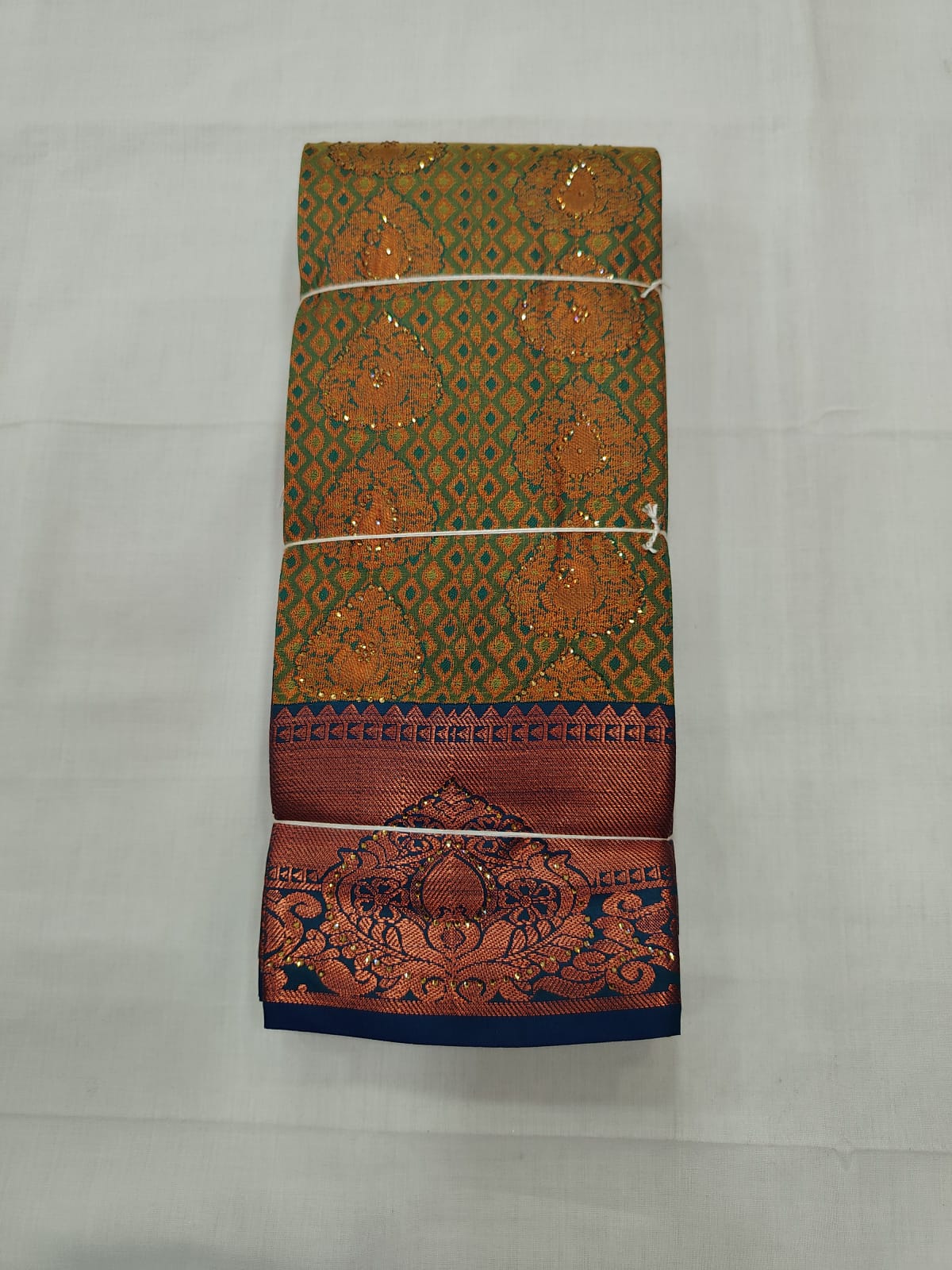 Premium Peacock Green Silk Saree with Rich Copper Zari Border